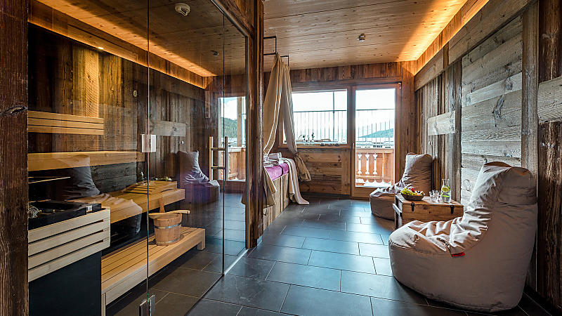 Private spa at almlust in Flachau with sauna, relaxation area and balcony view