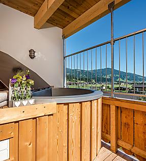 Private hot tub on the balcony in the private spa at almlust in Flachau with mountain view
