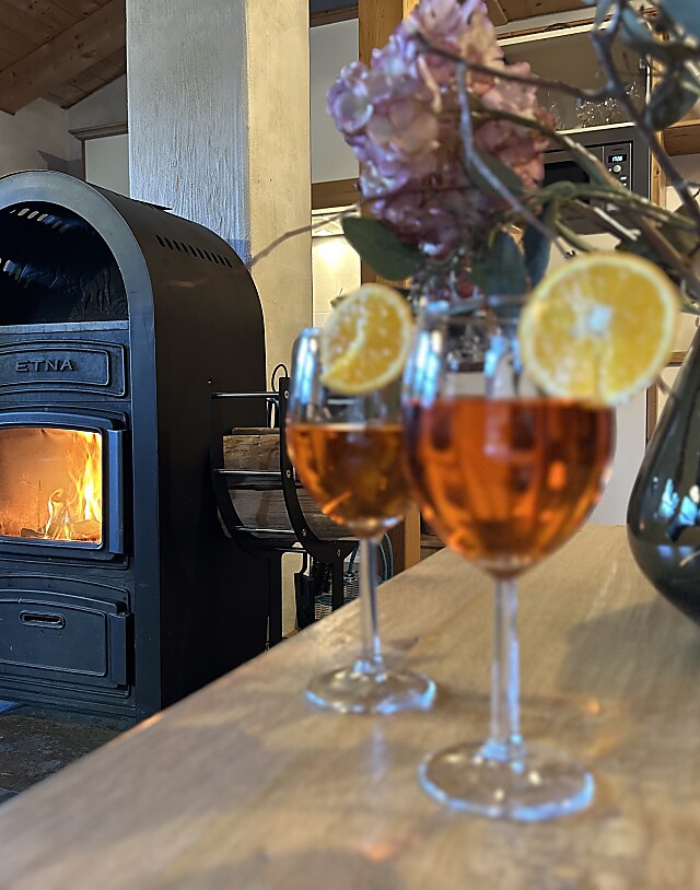 chalet living space with aperol glasses in front