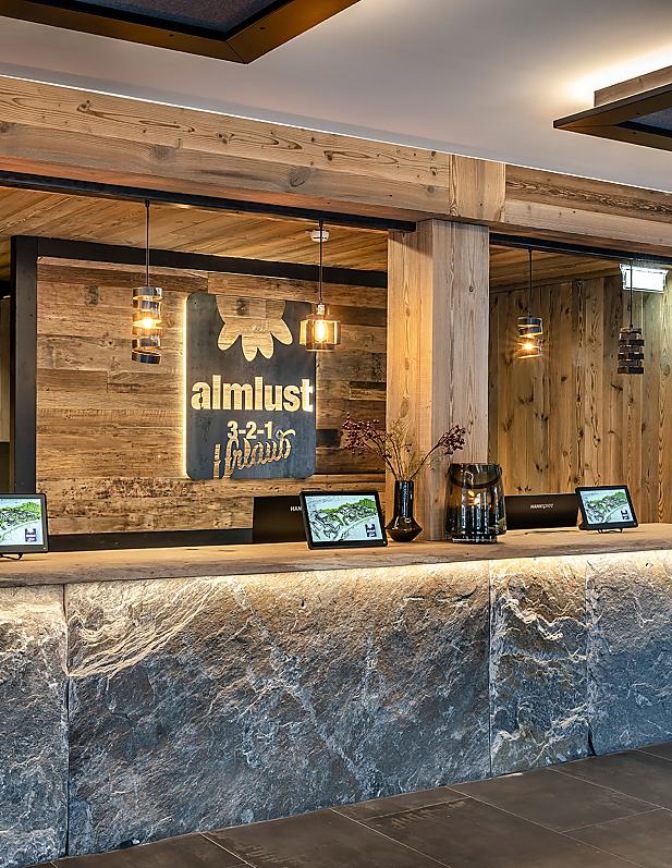Arriving at almlust Flachau – stylish reception with Alpine flair & the warmest welcome.